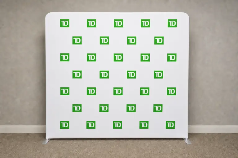 Staged visualization of the TD green logo wall based on a completed purchased 8 by 8 custom backdrop