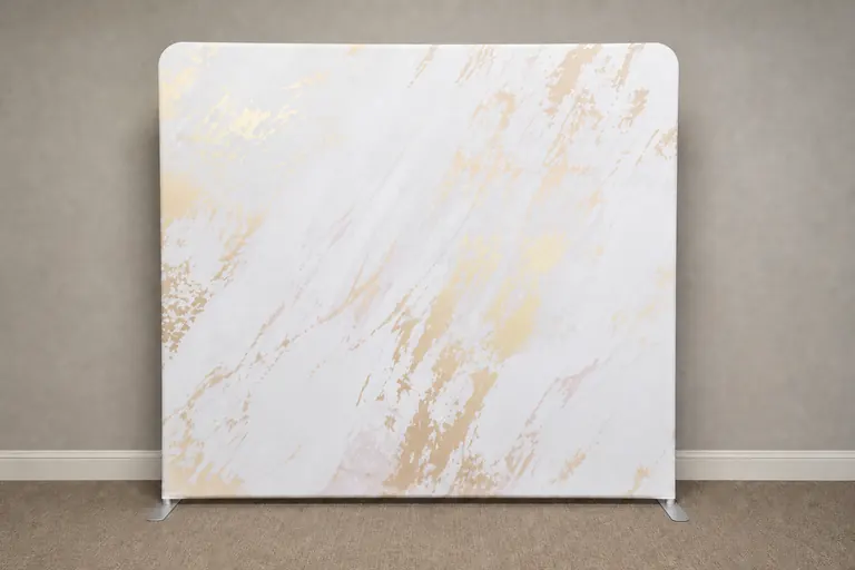Gold and white marble 8 by 8 photo booth backdrop installed in a neutral event space