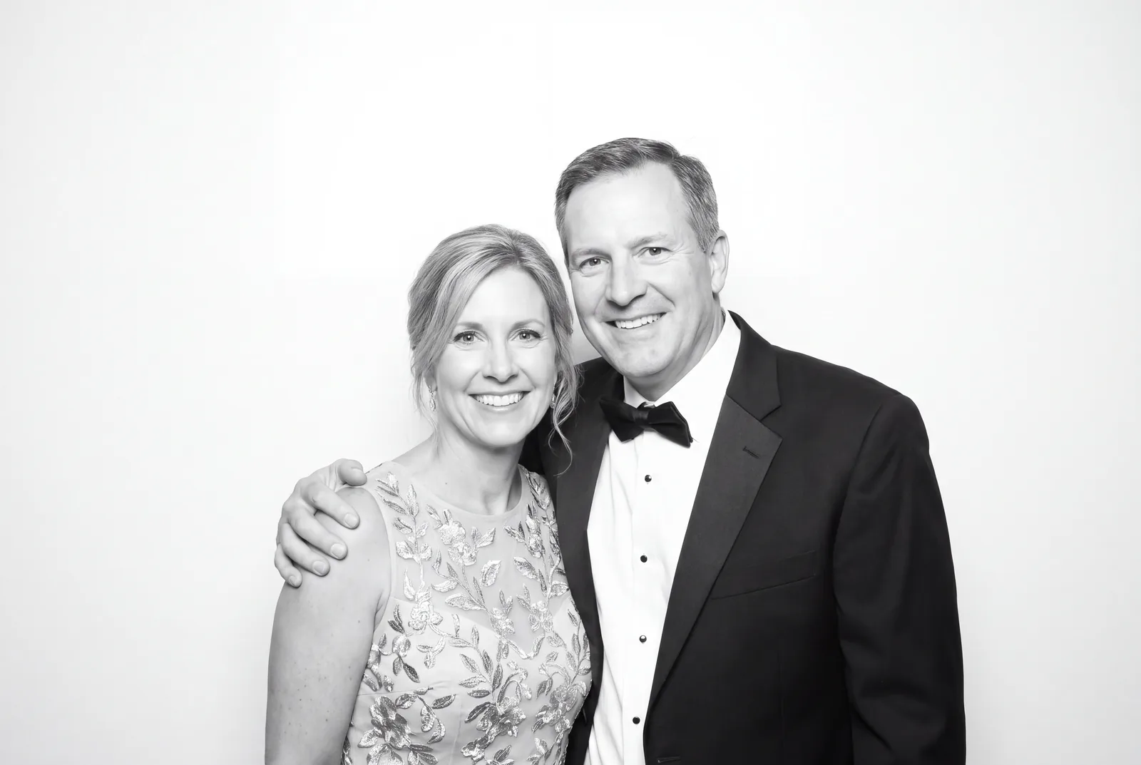 Guests posing for a polished black-and-white Glam Booth portrait, photo 1
