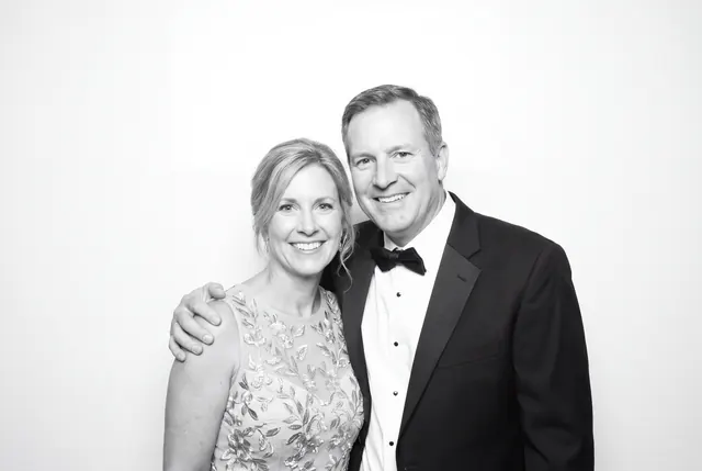 Guests posing for a polished black-and-white Glam Booth portrait, photo 1