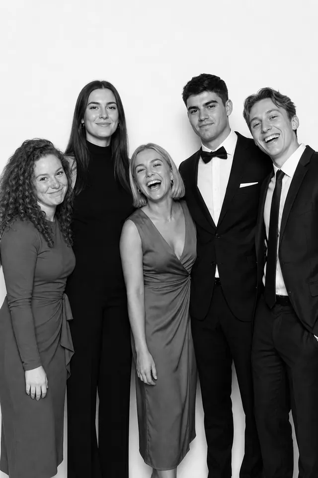 Guests posing for a polished black-and-white Glam Booth portrait, photo 4