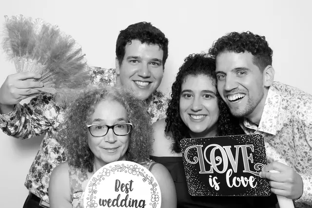 Guests posing for a polished black-and-white Glam Booth portrait, photo 5