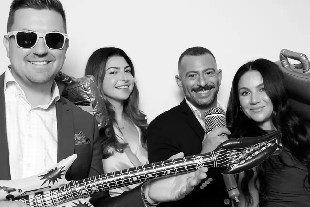 Guests posing for a polished black-and-white Glam Booth portrait, photo 13