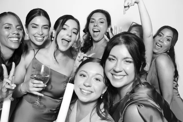 Guests posing for a polished black-and-white Glam Booth portrait, photo 16