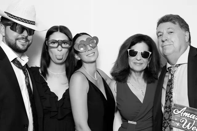 Guests posing for a polished black-and-white Glam Booth portrait, photo 17