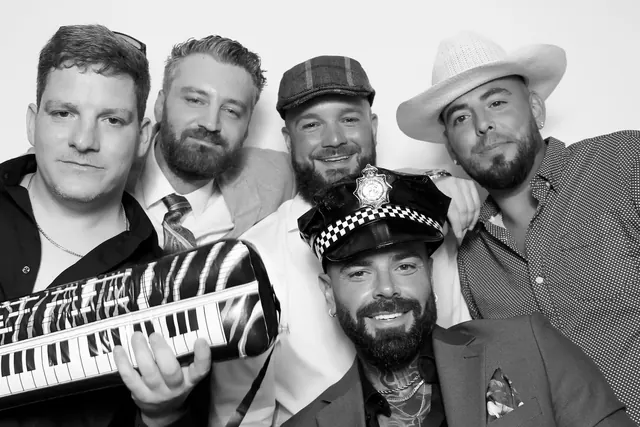 Guests posing for a polished black-and-white Glam Booth portrait, photo 18
