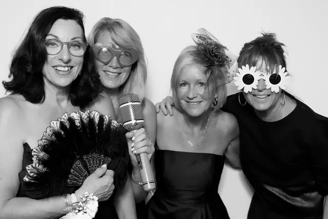 Guests posing for a polished black-and-white Glam Booth portrait, photo 19