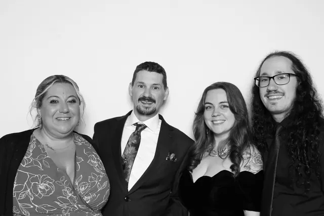 Guests posing for a polished black-and-white Glam Booth portrait, photo 24