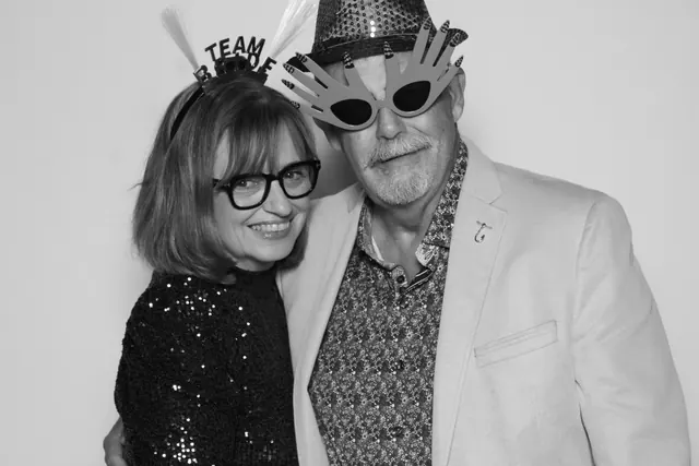 Guests posing for a polished black-and-white Glam Booth portrait, photo 27