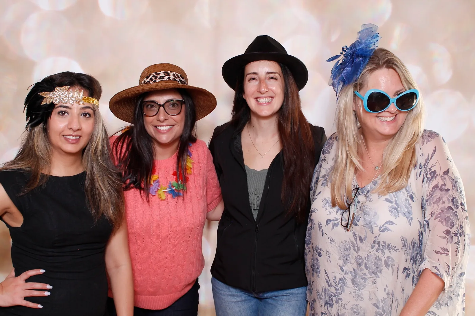 Guests enjoying a photo booth with a champagne backdrop, photo 4