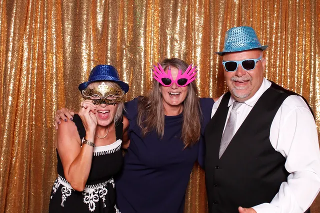 Guests enjoying a photo booth with a gold sequin backdrop, photo 11