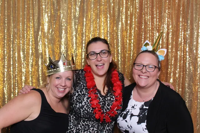 Guests enjoying a photo booth with a gold sequin backdrop, photo 21