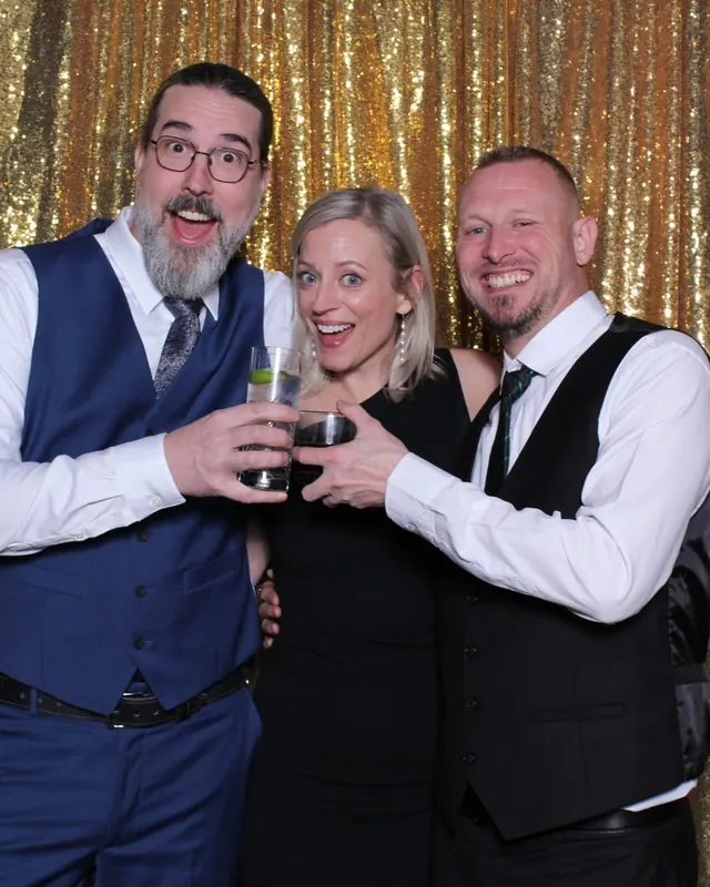 Guests enjoying a photo booth with a gold sequin backdrop, photo 24