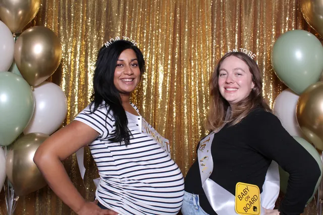 Guests enjoying a photo booth with a gold sequin backdrop, photo 31