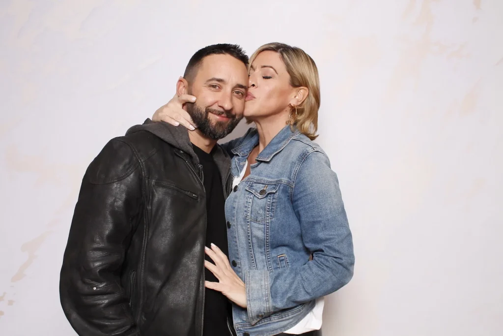 Two EPN Social guests posing together against a light white photo booth background